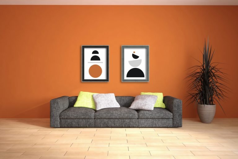 Picture frames on orange wall